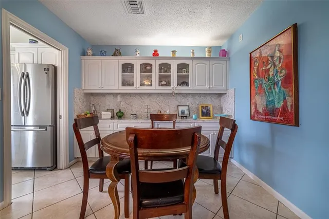 a table and chairs in a kitchen