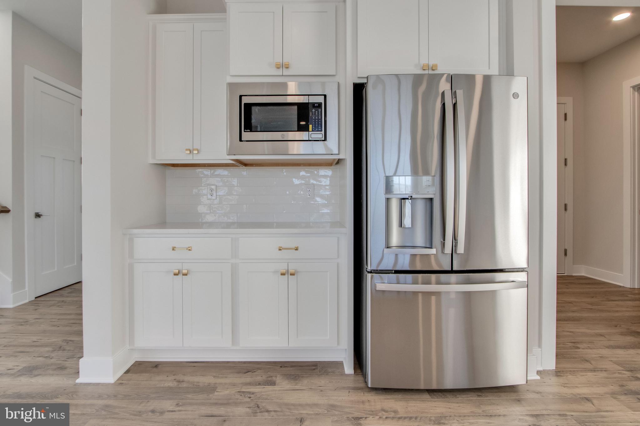30491 Blue Beech Lane Frankford, DE 19945 - Photo 24 of 73 a kitchen with appliances and cabinets