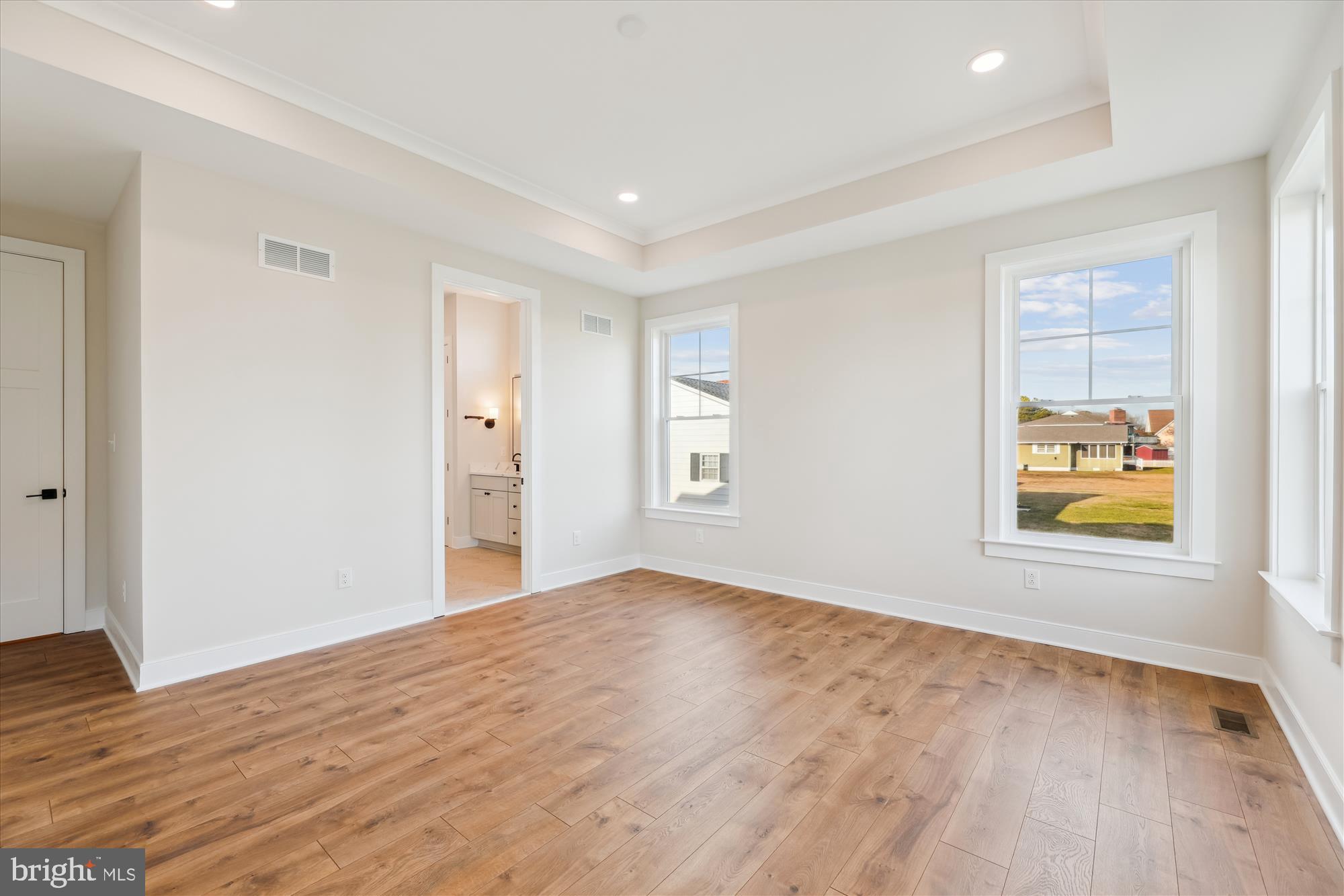 30491 Blue Beech Lane Frankford, DE 19945 - Photo 30 of 73 a view of empty room with wooden floor and window