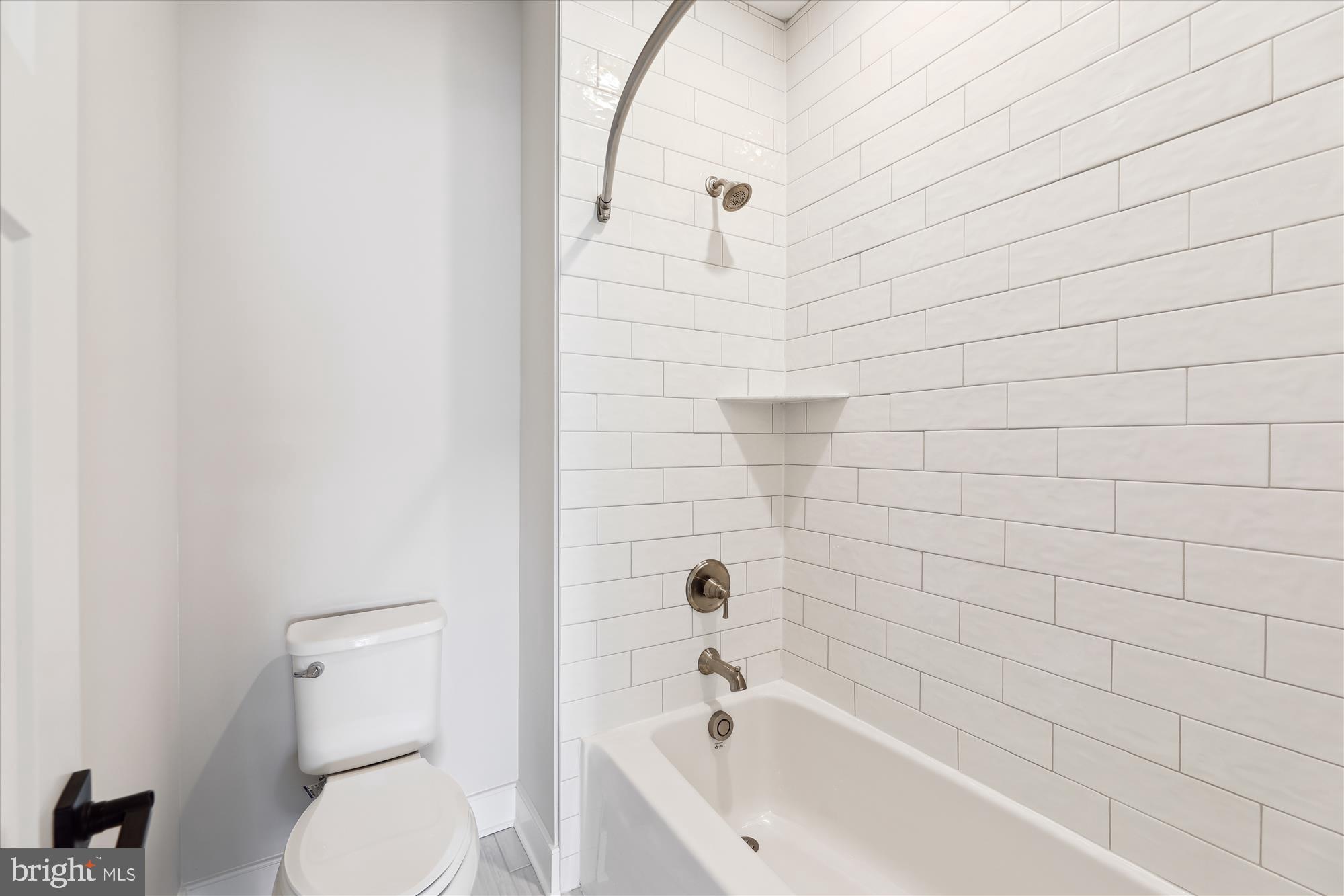 30491 Blue Beech Lane Frankford, DE 19945 - Photo 7 of 13 a bathroom with a toilet and bathtub