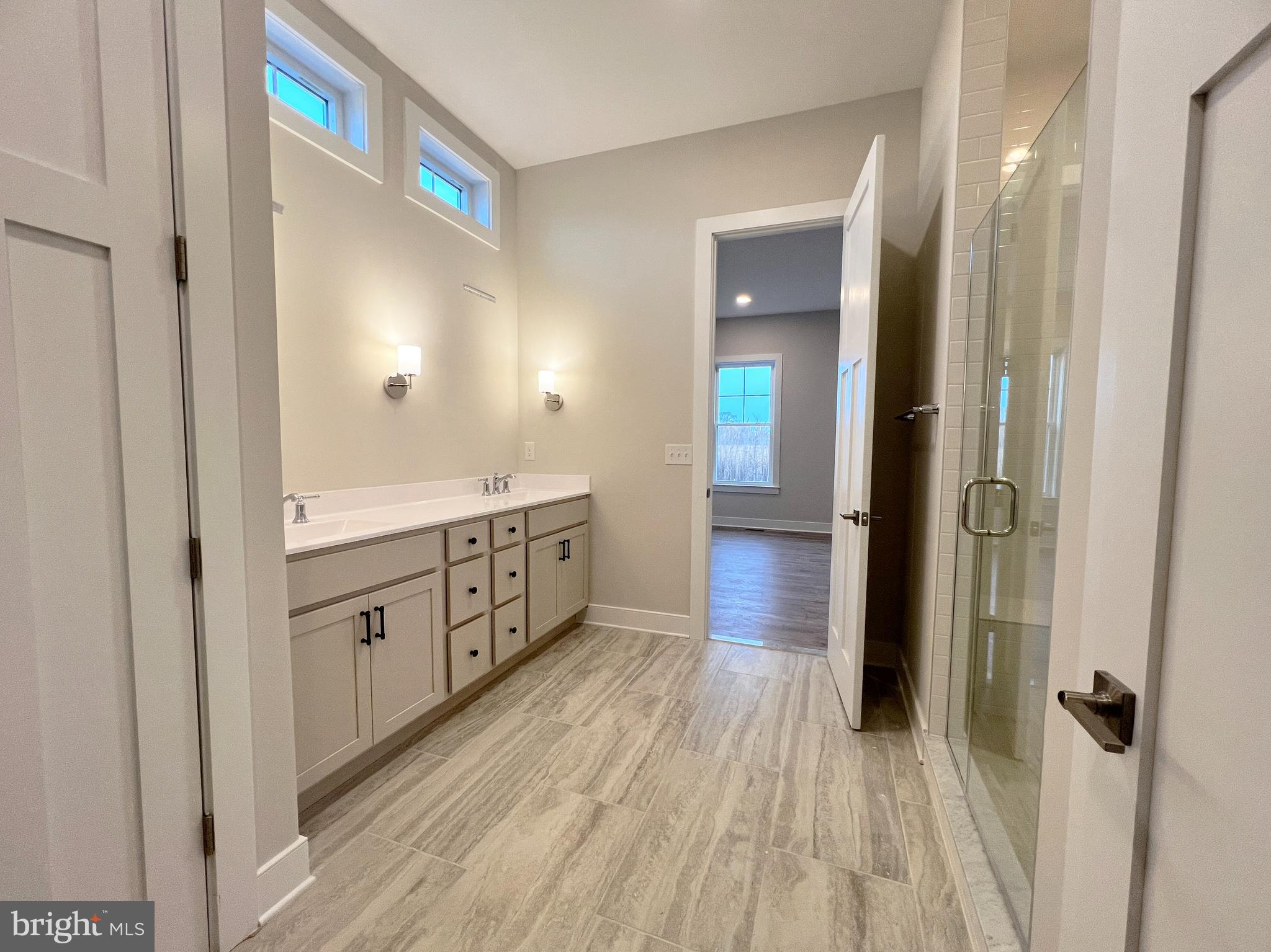 30491 Blue Beech Lane Frankford, DE 19945 - Photo 9 of 13 a bathroom with a sink and a mirror