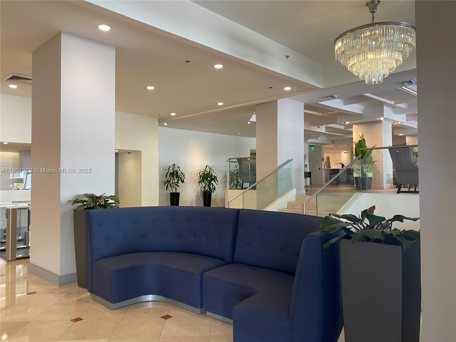 100 Lincoln Road, Unit 1111 Miami Beach, FL 33139 - Photo 16 of 30 a living room with furniture chandelier and kitchen view