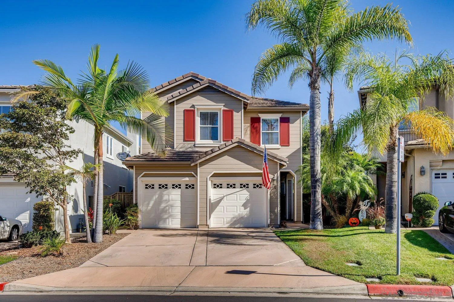 1332 Enchante Way Oceanside, CA 92056 - Photo 1 of 28 a front view of a house with a yard