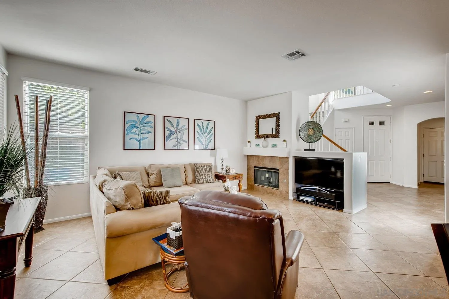 1332 Enchante Way Oceanside, CA 92056 - Photo 11 of 28 a living room with furniture and a fireplace