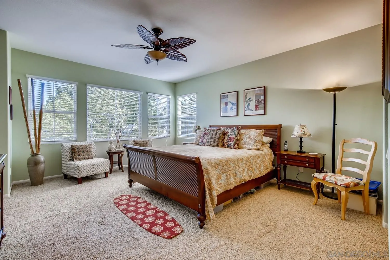 1332 Enchante Way Oceanside, CA 92056 - Photo 13 of 28 a spacious bedroom with a bed and a couch