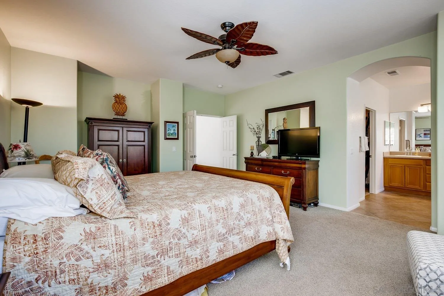 1332 Enchante Way Oceanside, CA 92056 - Photo 14 of 28 a bedroom with a bed and a flat screen tv