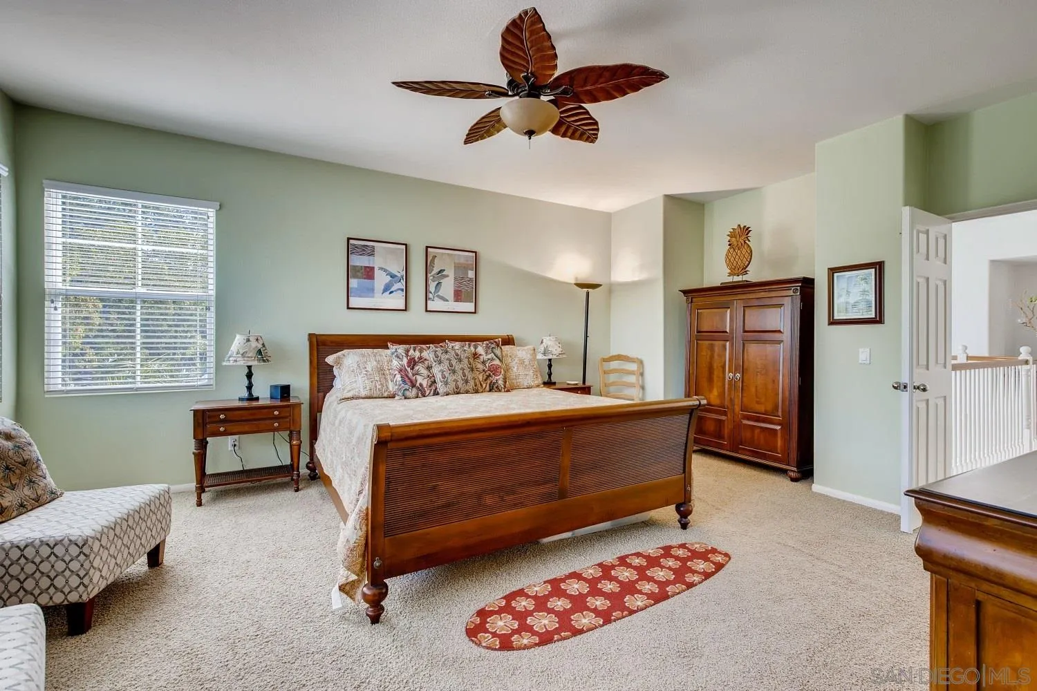 1332 Enchante Way Oceanside, CA 92056 - Photo 15 of 28 a bedroom with a bed and a chandelier