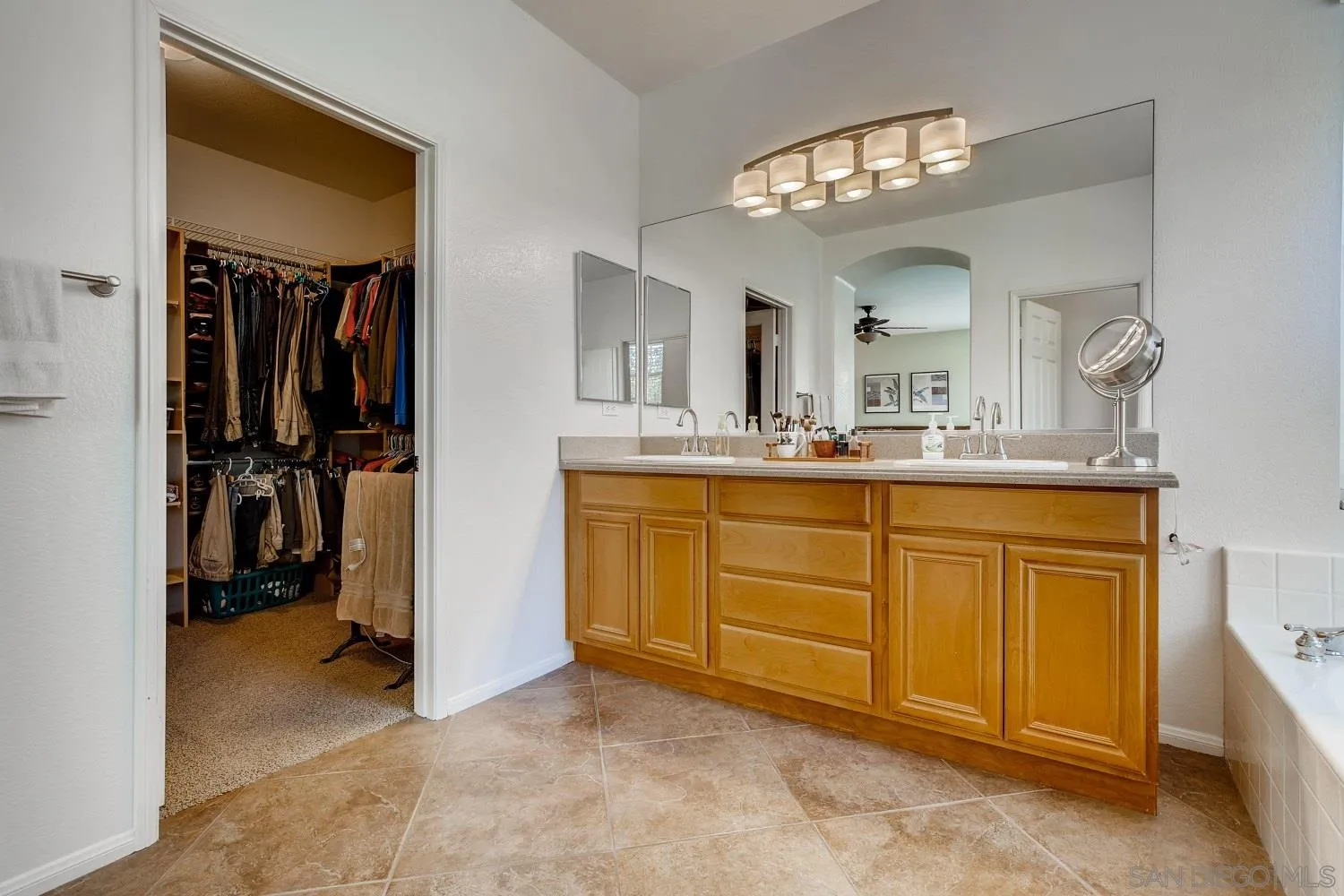 1332 Enchante Way Oceanside, CA 92056 - Photo 17 of 28 a bathroom with a sink and a mirror