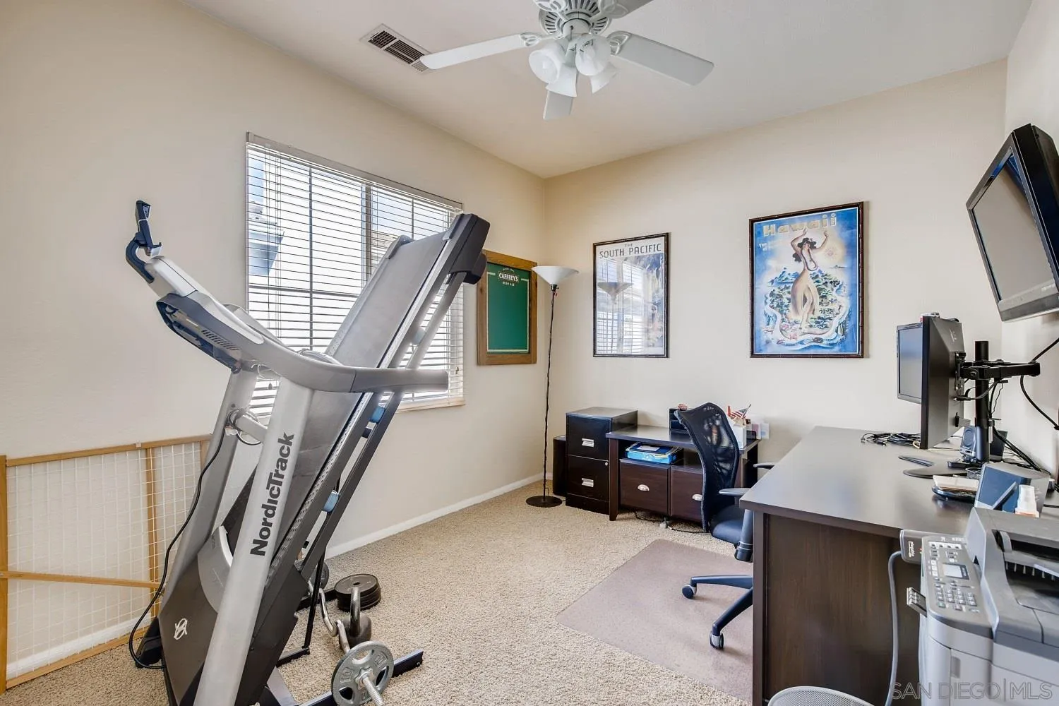1332 Enchante Way Oceanside, CA 92056 - Photo 18 of 28 a livingroom with workspace window and a couch