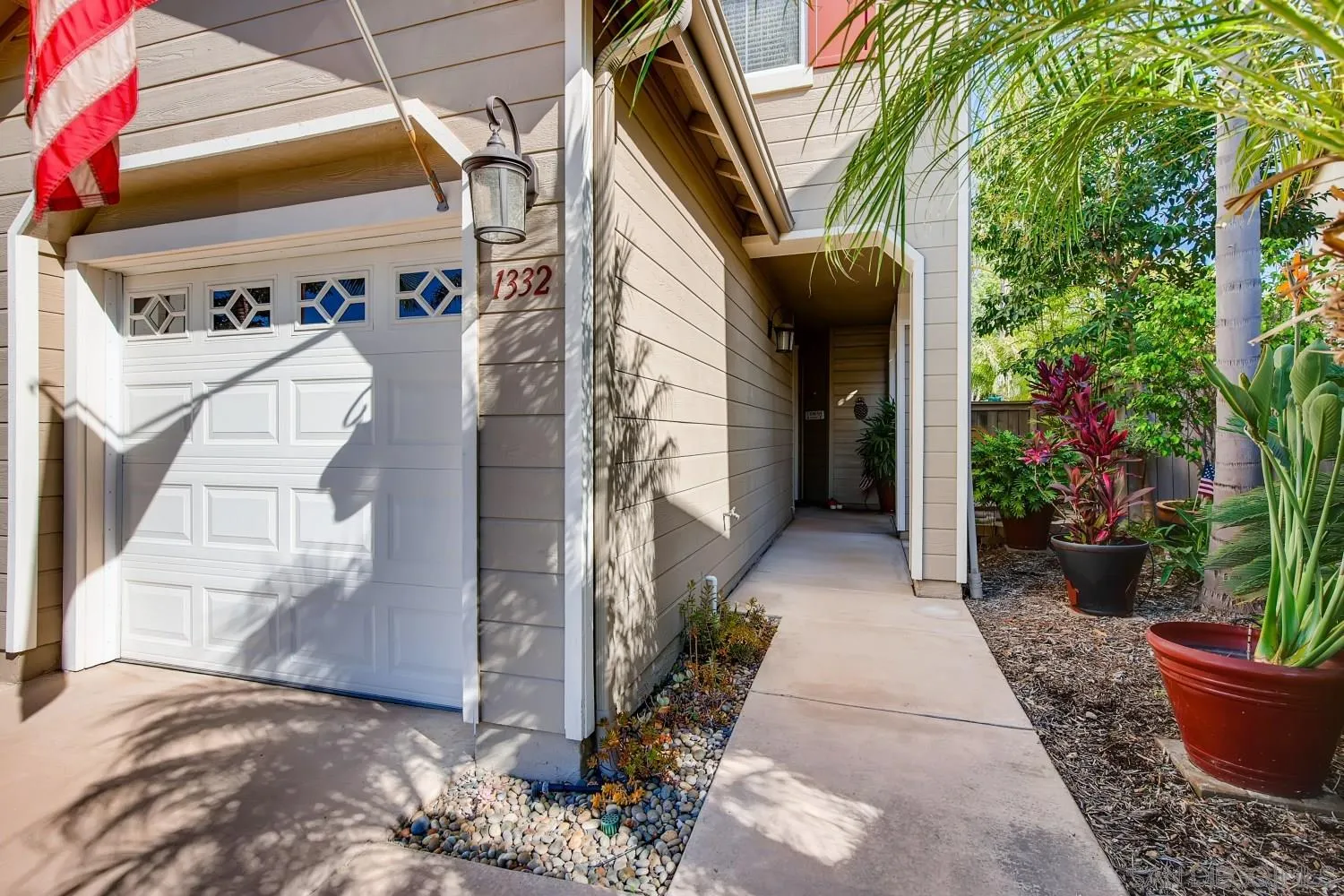 1332 Enchante Way Oceanside, CA 92056 - Photo 2 of 28 a view of a house with potted plants