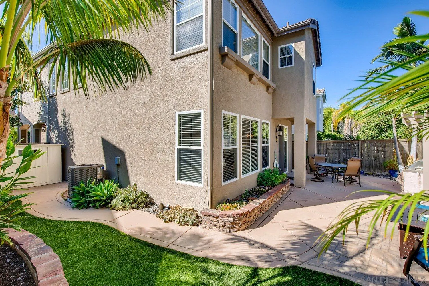 1332 Enchante Way Oceanside, CA 92056 - Photo 28 of 28 a view of a backyard with a patio table and chairs