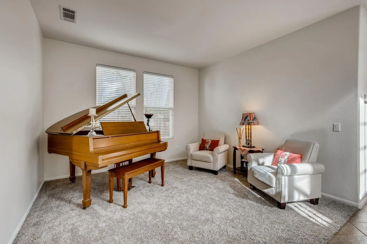 1332 Enchante Way Oceanside, CA 92056 - Photo 3 of 28 a reading room with furniture and a wooden floor