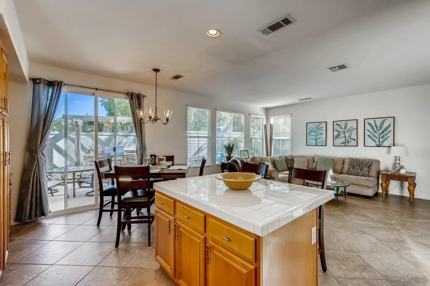 1332 Enchante Way Oceanside, CA 92056 - Photo 9 of 28 a view of a dining room with furniture window and outside view