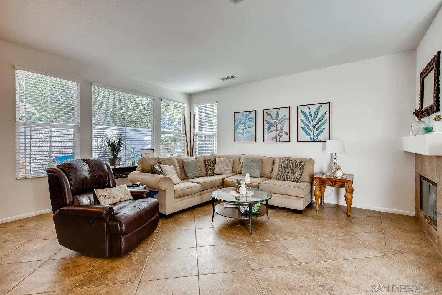 1332 Enchante Way Oceanside, CA 92056 - Photo 10 of 28 a living room with furniture and a large window