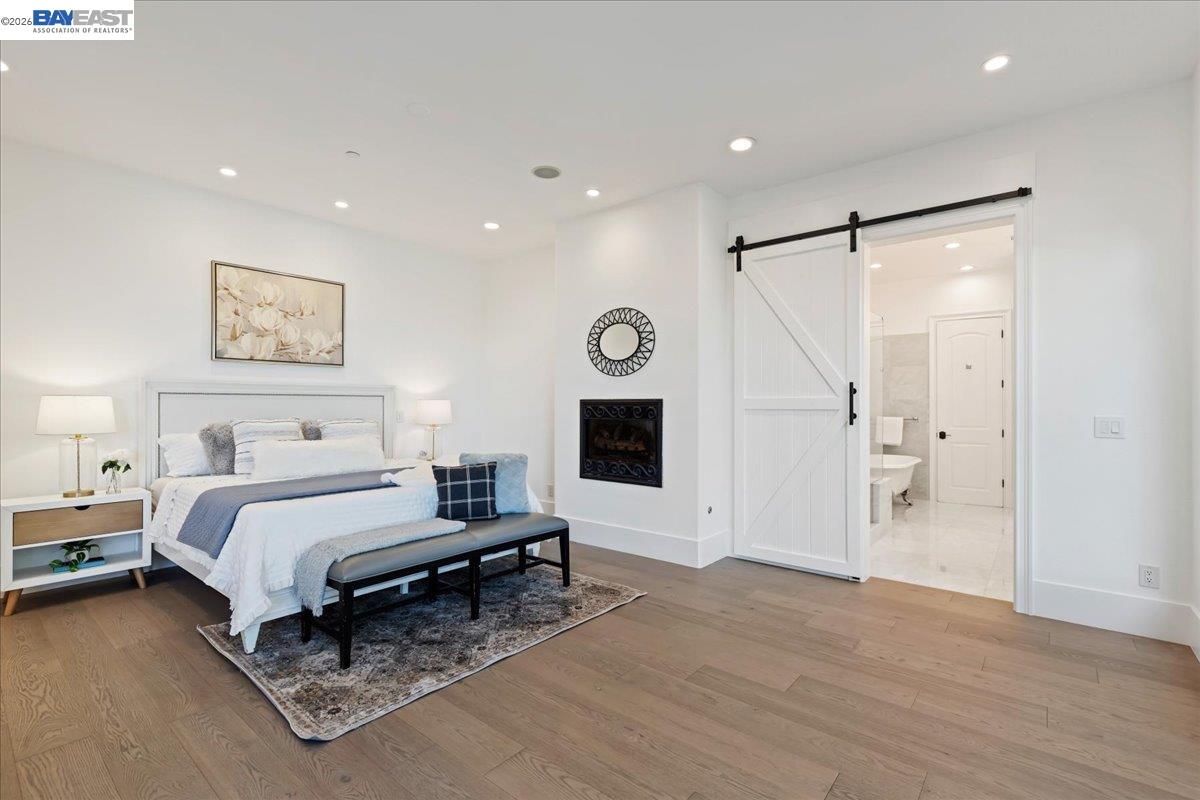 12400 Morgan Territory Road Livermore, CA 94551 - Photo 26 of 59 a spacious bedroom with a bed and a walk in closet