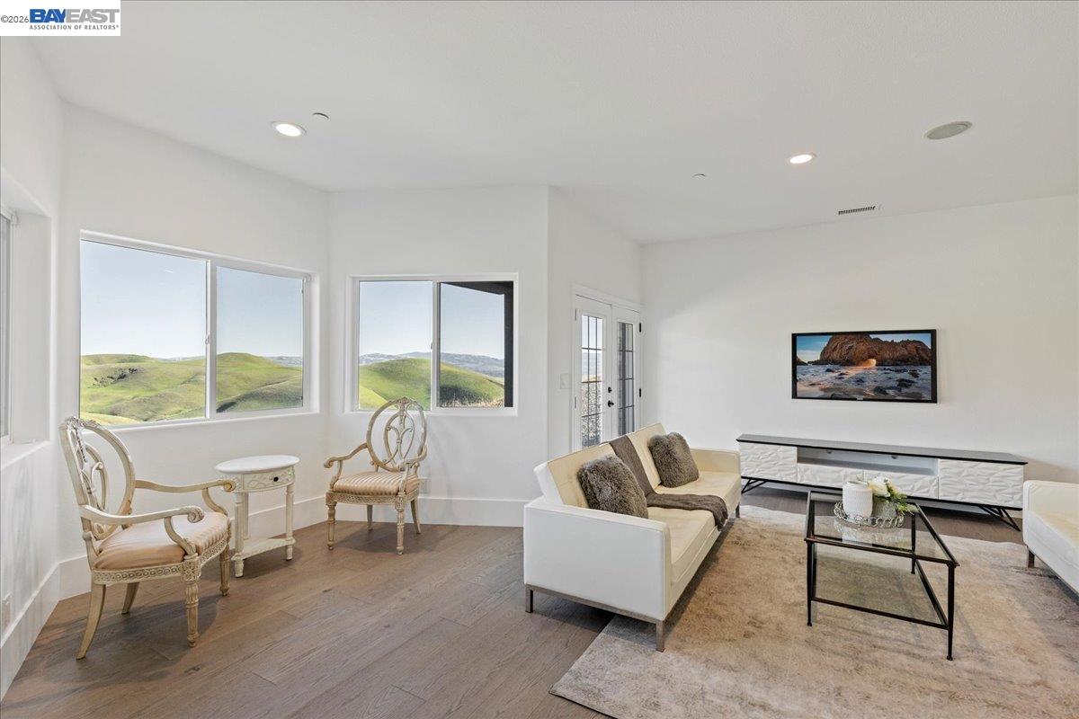 12400 Morgan Territory Road Livermore, CA 94551 - Photo 34 of 59 a living room with furniture and a large window