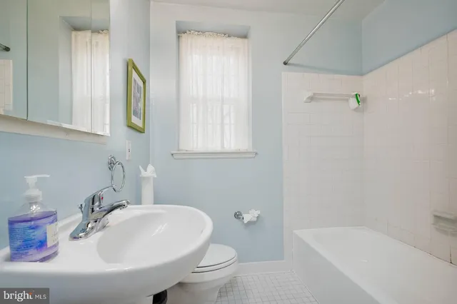 a bathroom with a sink and a bathtub