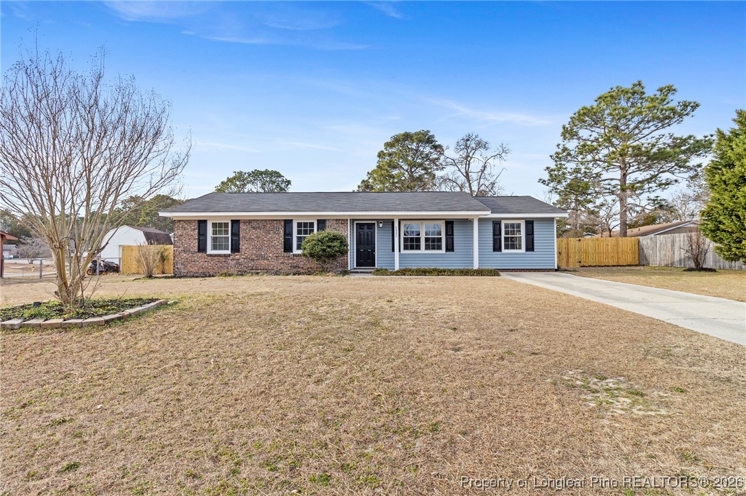 5982 Spinner Road Hope Mills, NC 28348 - Photo 1 of 32 a front view of a house with a yard