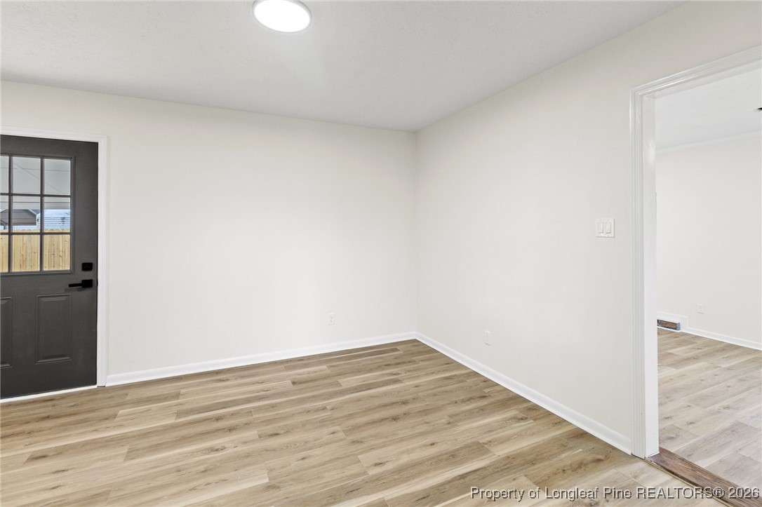 5982 Spinner Road Hope Mills, NC 28348 - Photo 11 of 32 a view of a room with wooden floor