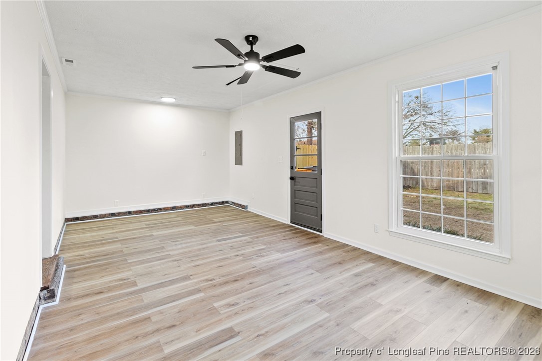 5982 Spinner Road Hope Mills, NC 28348 - Photo 15 of 32 wooden floor in an empty room with a window