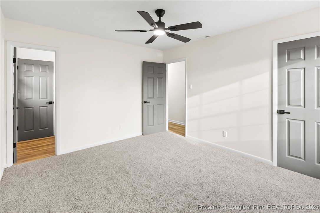 5982 Spinner Road Hope Mills, NC 28348 - Photo 19 of 32 a view of a livingroom with a ceiling fan