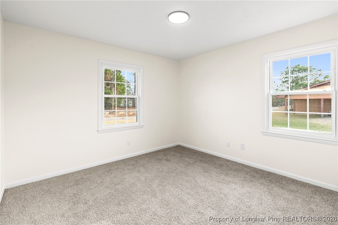 5982 Spinner Road Hope Mills, NC 28348 - Photo 21 of 32 an empty room with a window