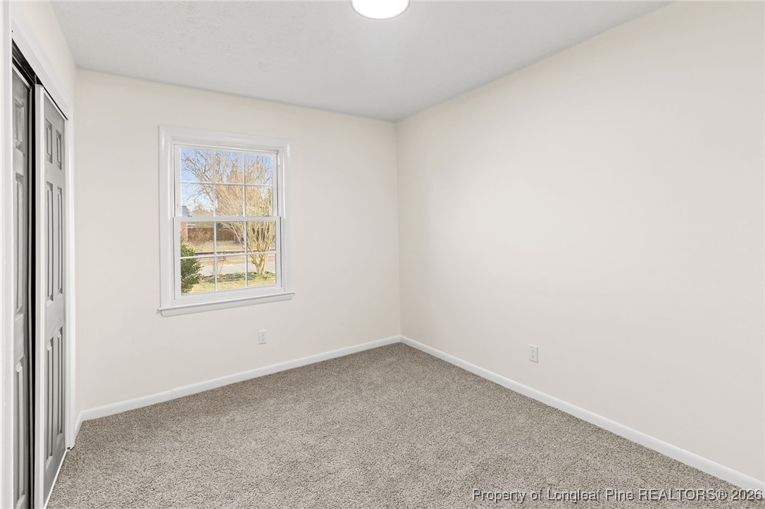 5982 Spinner Road Hope Mills, NC 28348 - Photo 23 of 32 an empty room with a window