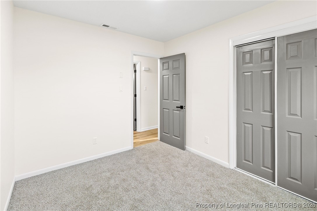 5982 Spinner Road Hope Mills, NC 28348 - Photo 24 of 32 an empty room with closet area