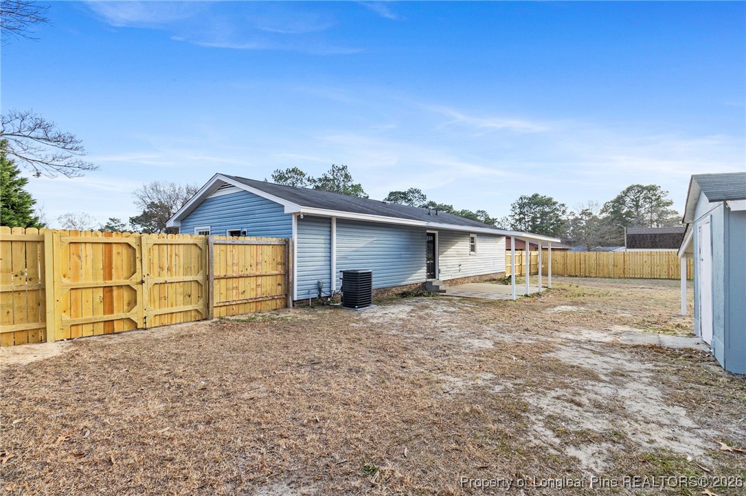 5982 Spinner Road Hope Mills, NC 28348 - Photo 27 of 32 a house with a outdoor space