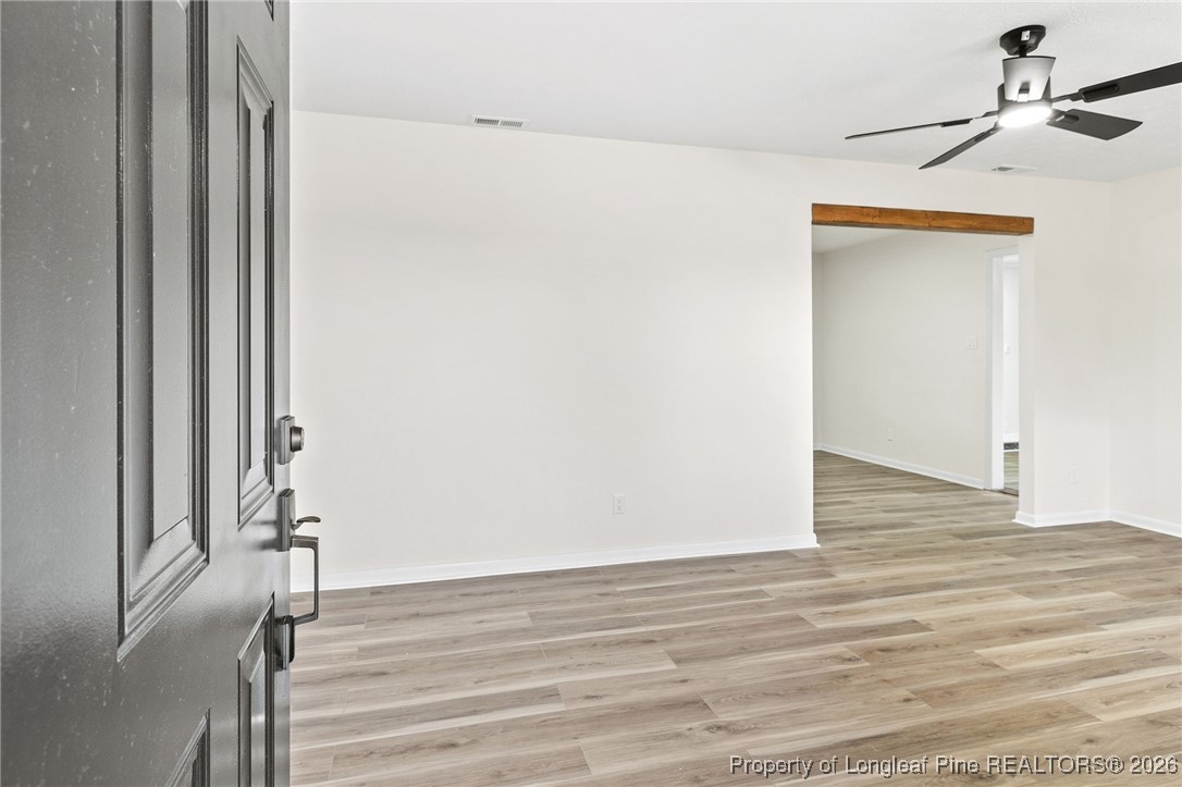 5982 Spinner Road Hope Mills, NC 28348 - Photo 5 of 32 a view of a room with wooden floor