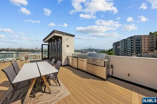 a view of a terrace with furniture and a table