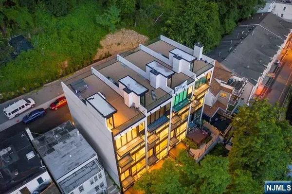 an aerial view of a house with a garden