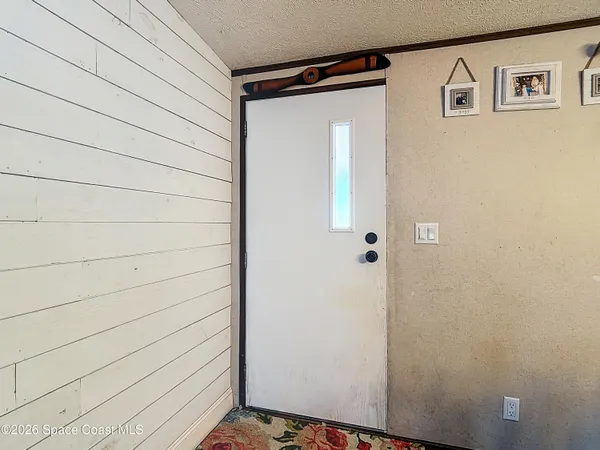 a view of a door and a window