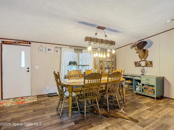 a view of a dining room with furniture