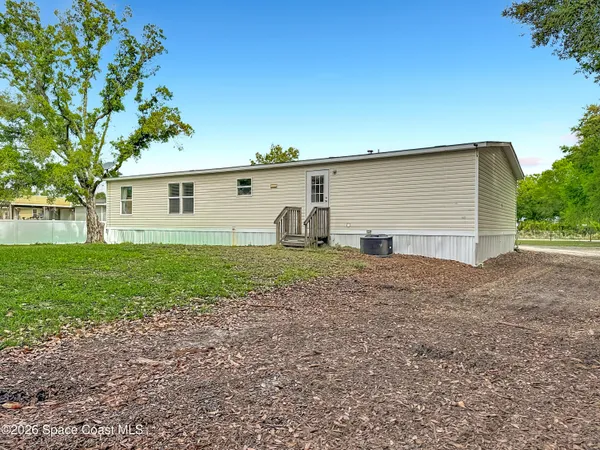 a view of a backyard with a garden