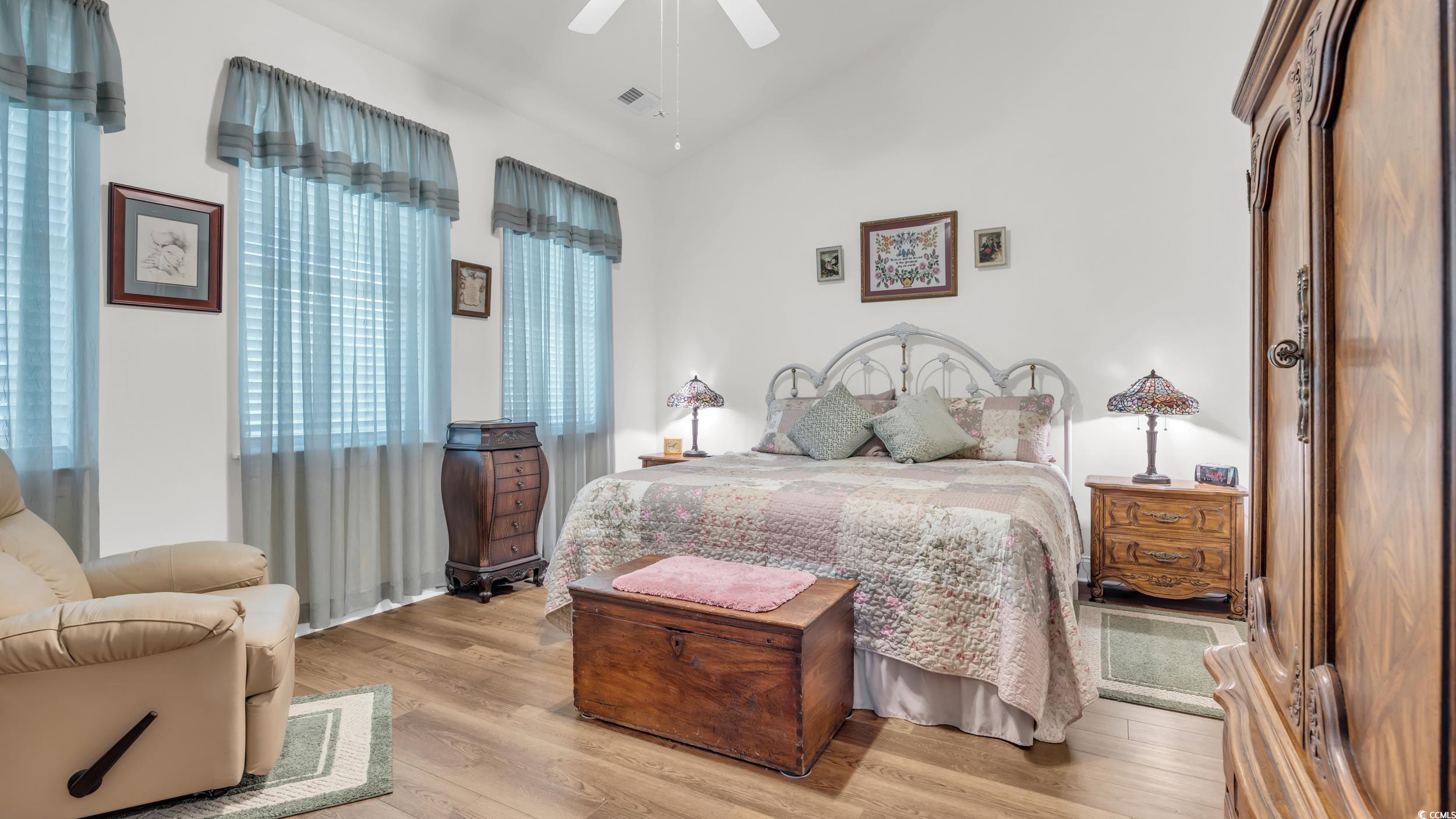 730 Pickering Drive, Unit 301 Murrells Inlet, SC 29576 - Photo 14 of 30 Bedroom featuring wood finished floors, vaulted ceiling, and ceiling fan