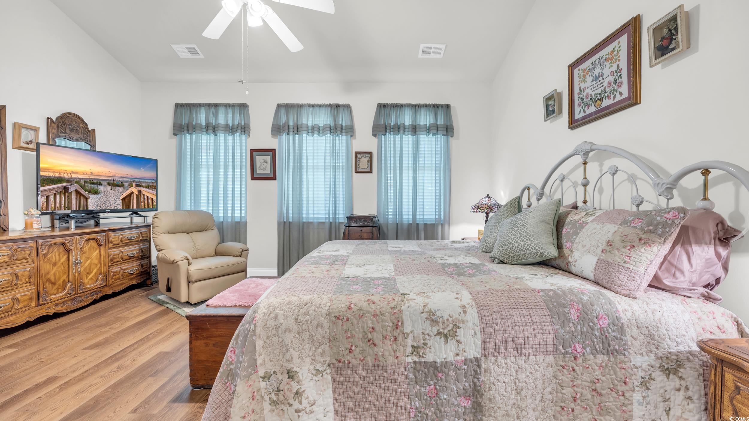 730 Pickering Drive, Unit 301 Murrells Inlet, SC 29576 - Photo 15 of 30 Bedroom featuring wood finished floors and ceiling fan