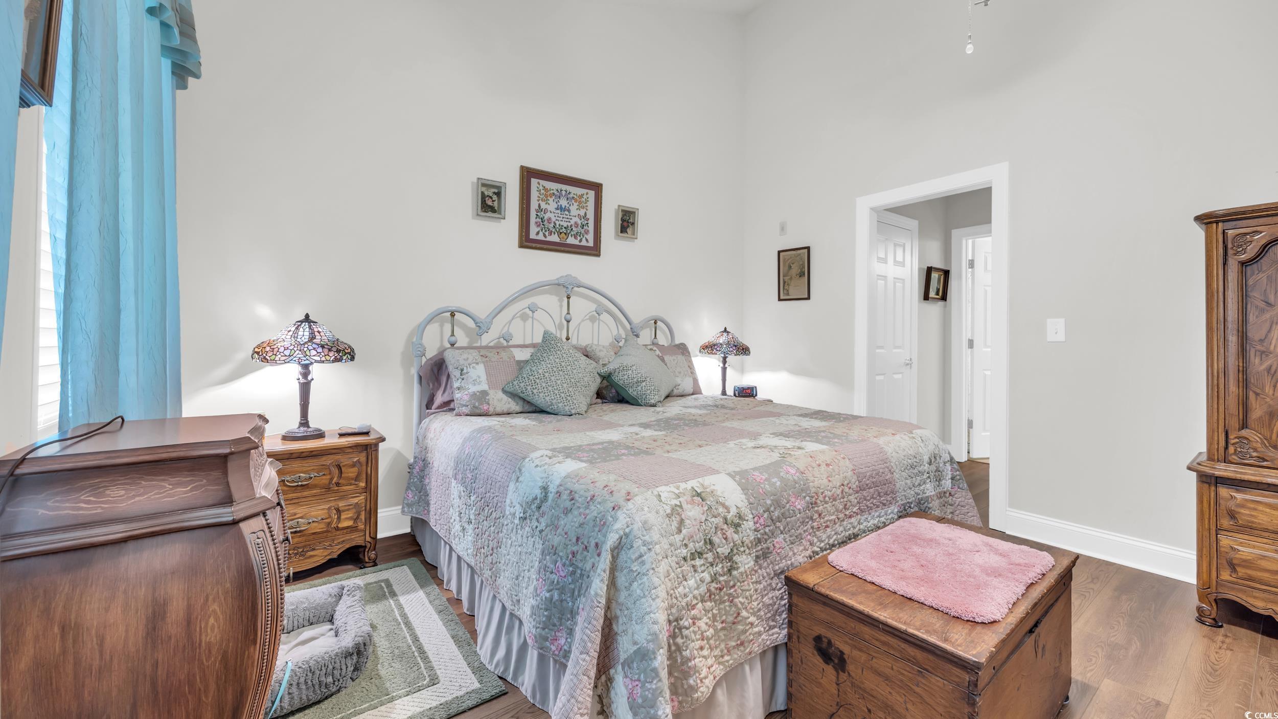 730 Pickering Drive, Unit 301 Murrells Inlet, SC 29576 - Photo 16 of 30 Bedroom with wood finished floors and a high ceiling