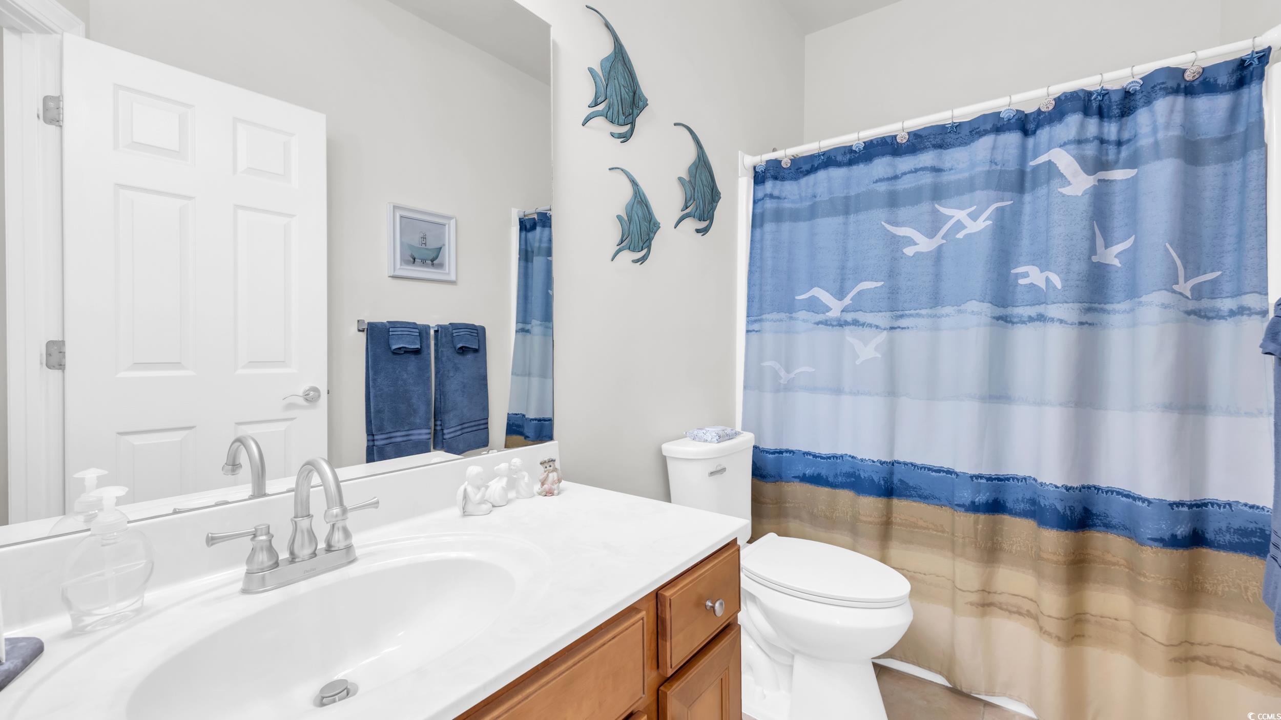 730 Pickering Drive, Unit 301 Murrells Inlet, SC 29576 - Photo 21 of 30 Full bath featuring vanity and a shower with curtain