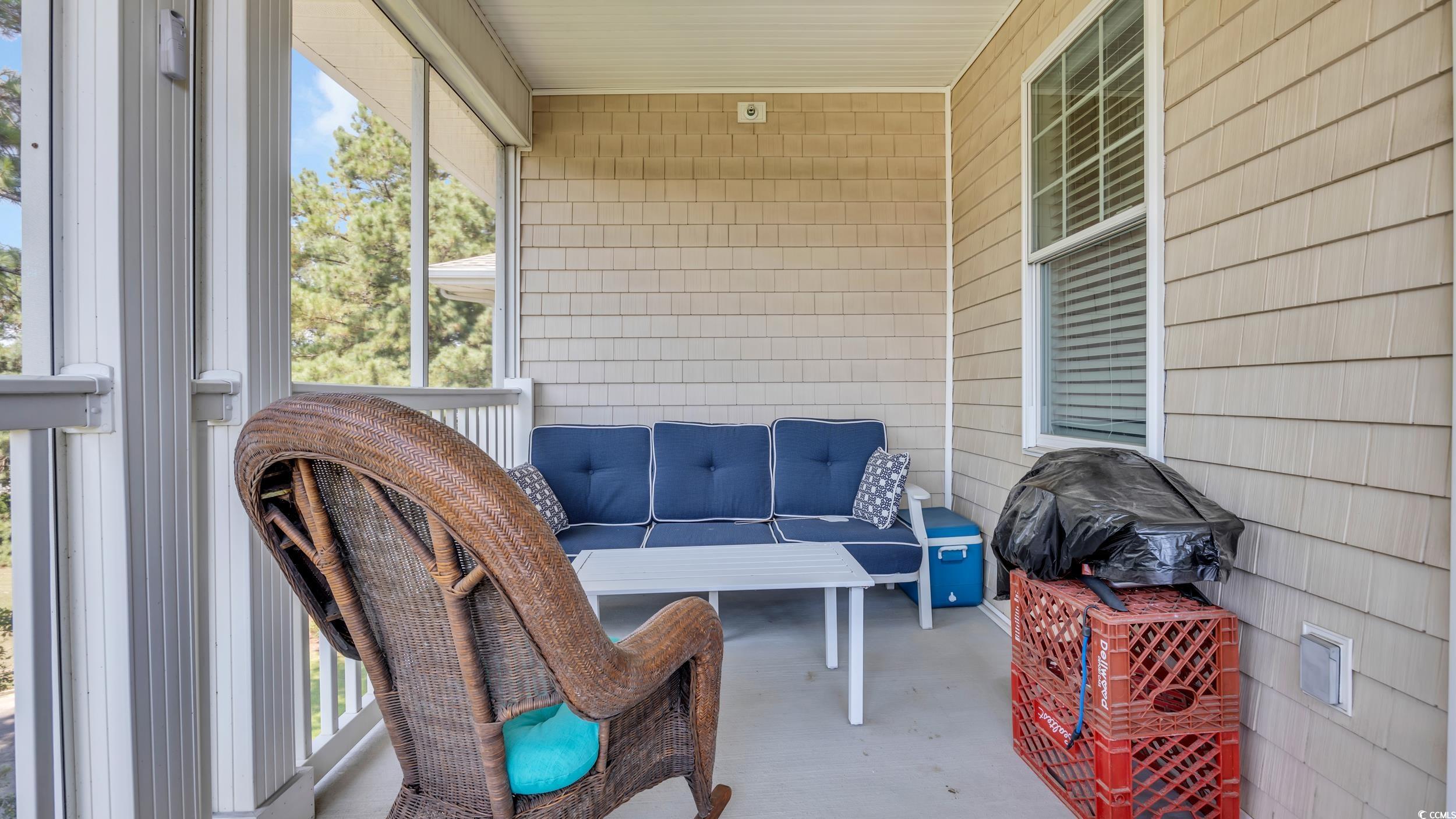 730 Pickering Drive, Unit 301 Murrells Inlet, SC 29576 - Photo 23 of 30 Sunroom / solarium with a balcony and outdoor lounge area