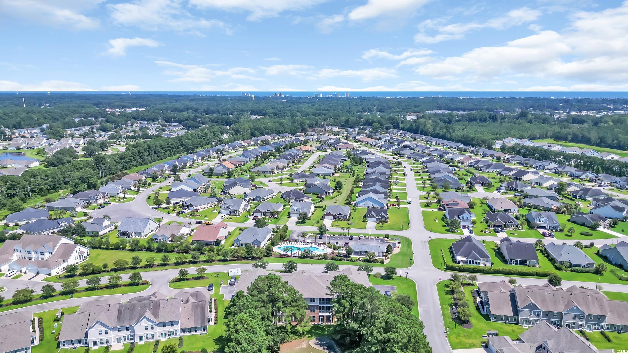 730 Pickering Drive, Unit 301 Murrells Inlet, SC 29576 - Photo 26 of 30 Aerial view of property's location with nearby suburban area and a tree filled landscape