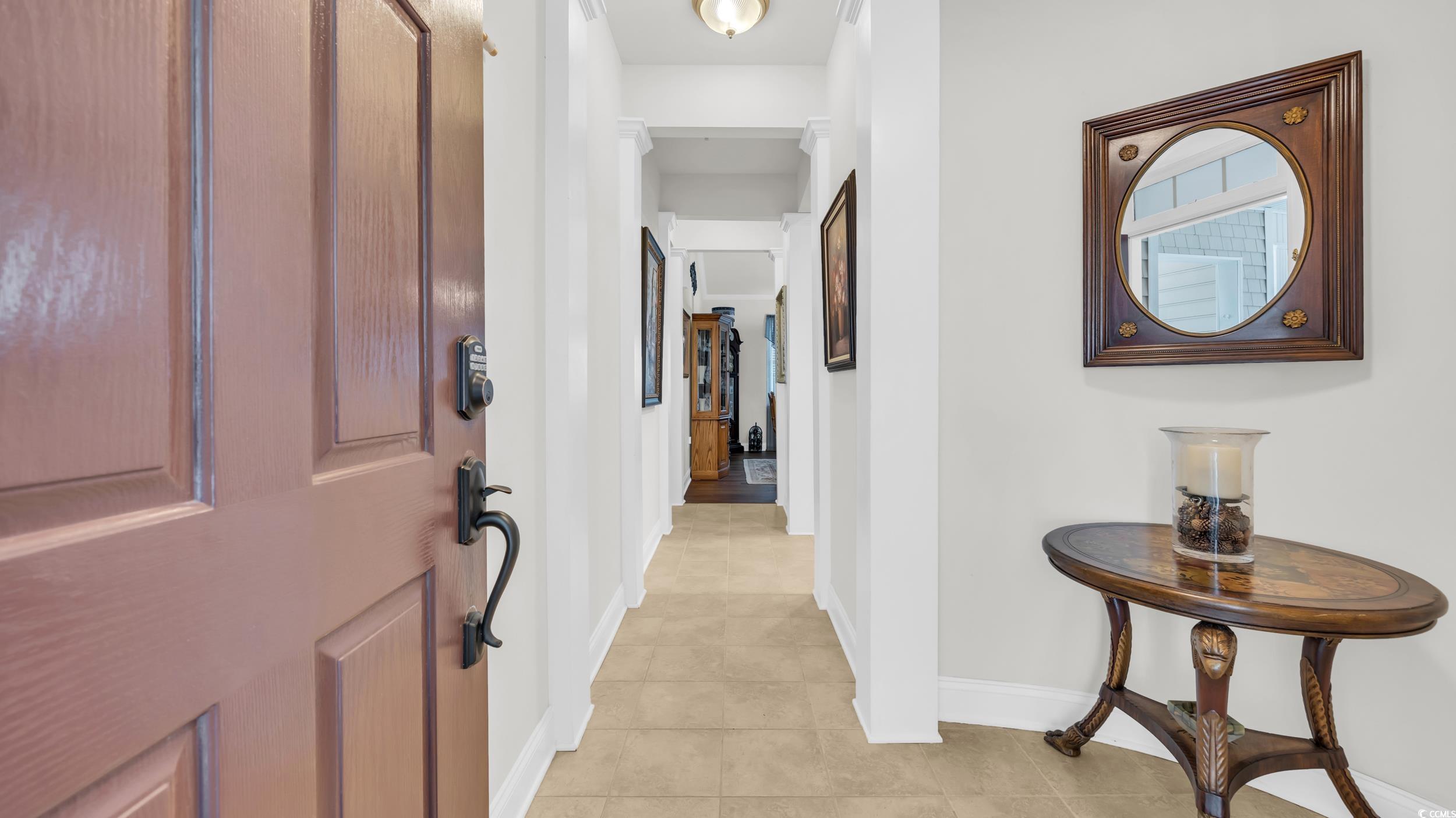 730 Pickering Drive, Unit 301 Murrells Inlet, SC 29576 - Photo 3 of 30 Foyer with baseboards and light tile patterned floors