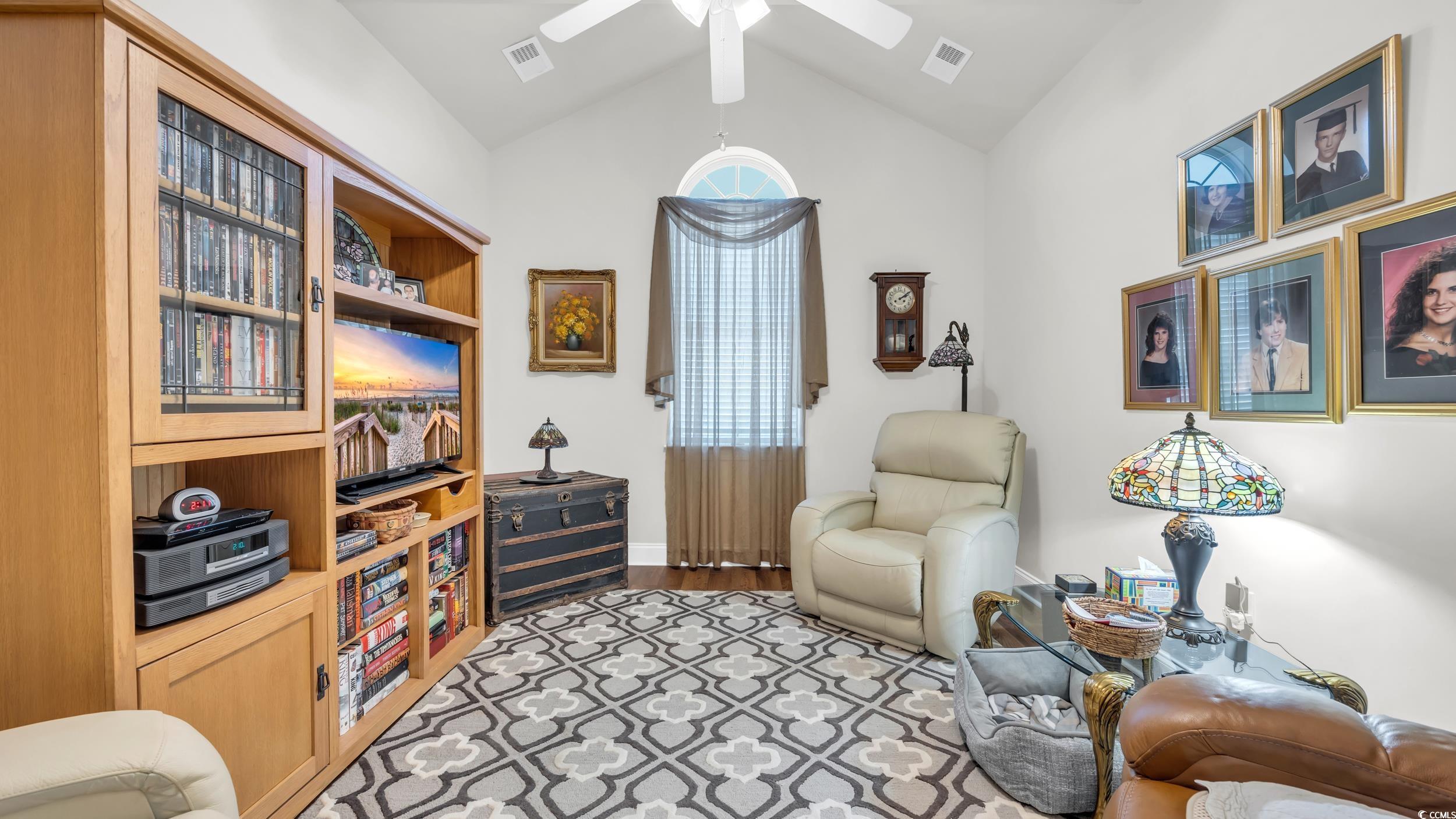 730 Pickering Drive, Unit 301 Murrells Inlet, SC 29576 - Photo 4 of 30 Living area featuring lofted ceiling and light wood finished floors