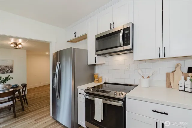 a kitchen with a stove and a microwave
