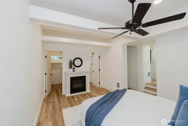 a bedroom with a bed and a fireplace