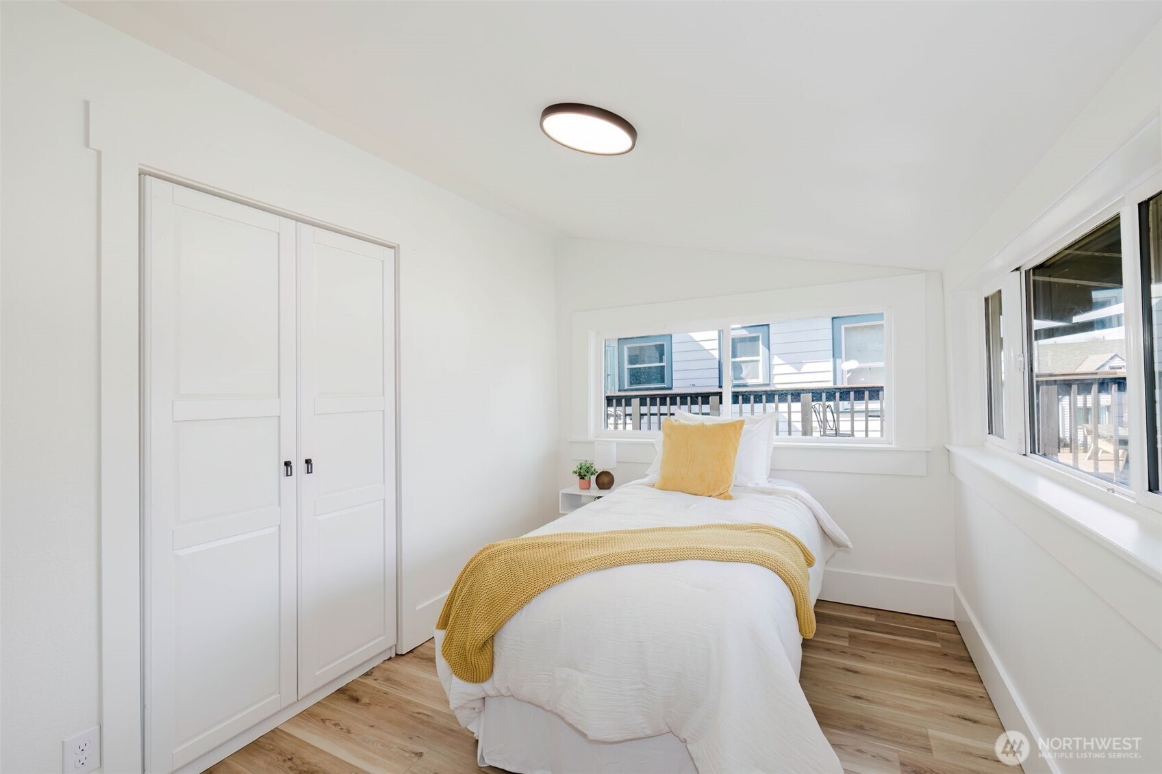 1540 7th Street Bremerton, WA 98337 - Photo 19 of 36 a bed sitting in a bedroom next to a window