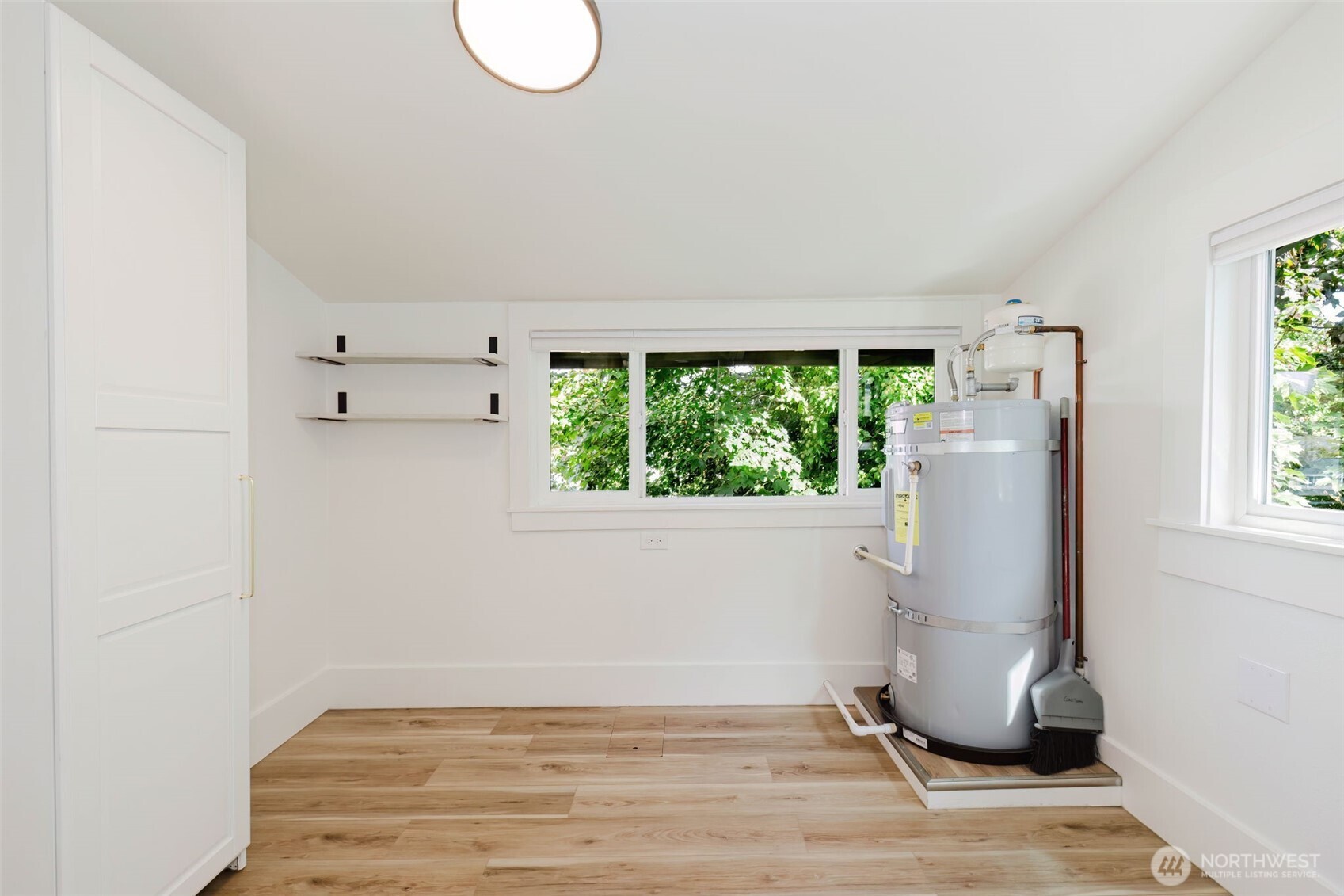 1540 7th Street Bremerton, WA 98337 - Photo 25 of 36 a view of a livingroom with wooden floor and a window