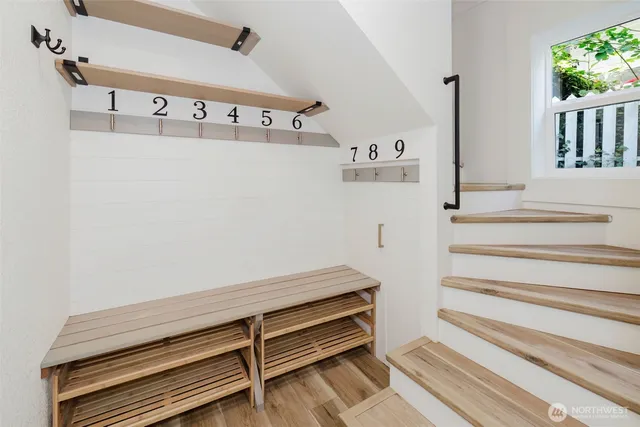 a view of staircase with wooden floor