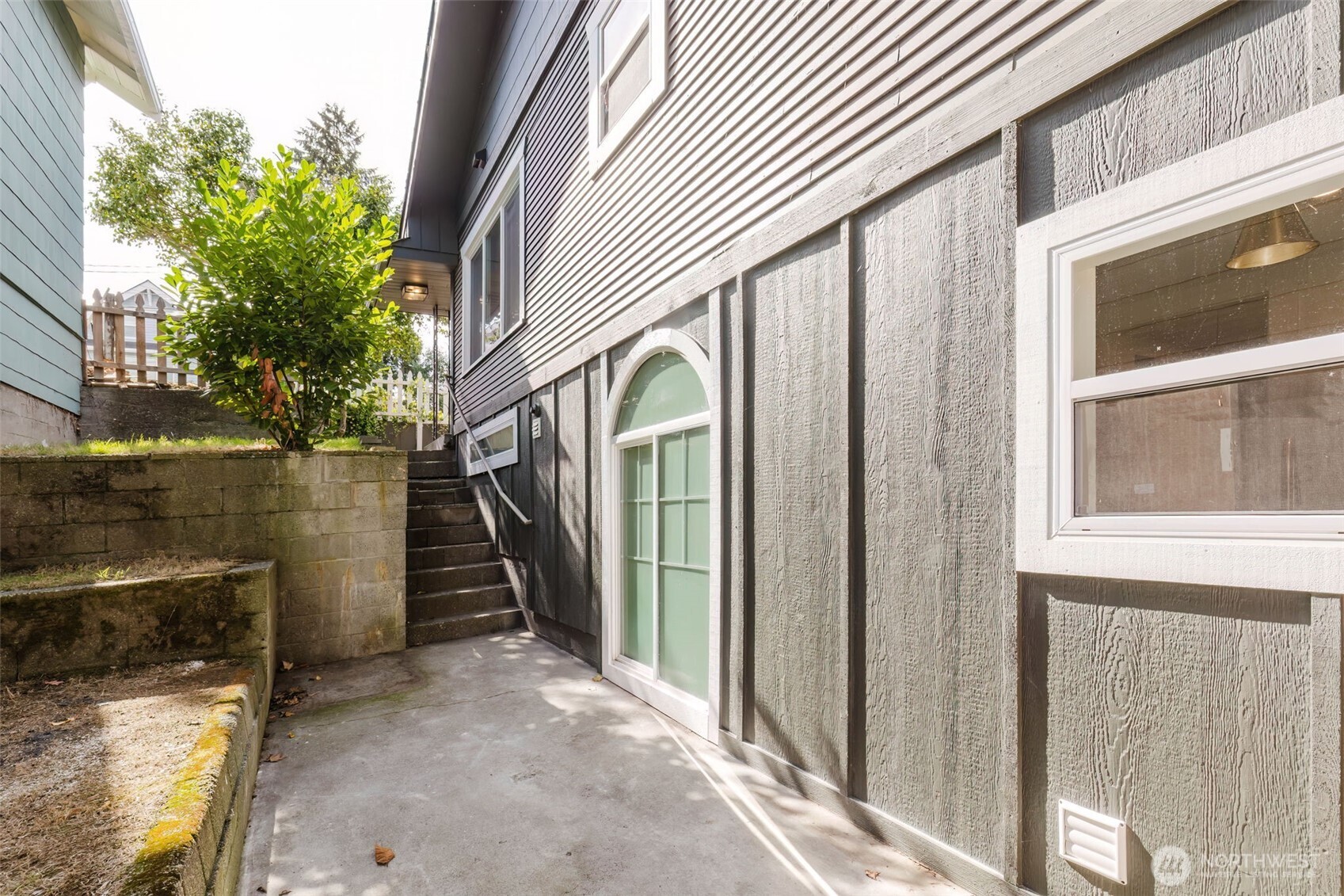 1540 7th Street Bremerton, WA 98337 - Photo 31 of 36 a view of a house with a backyard