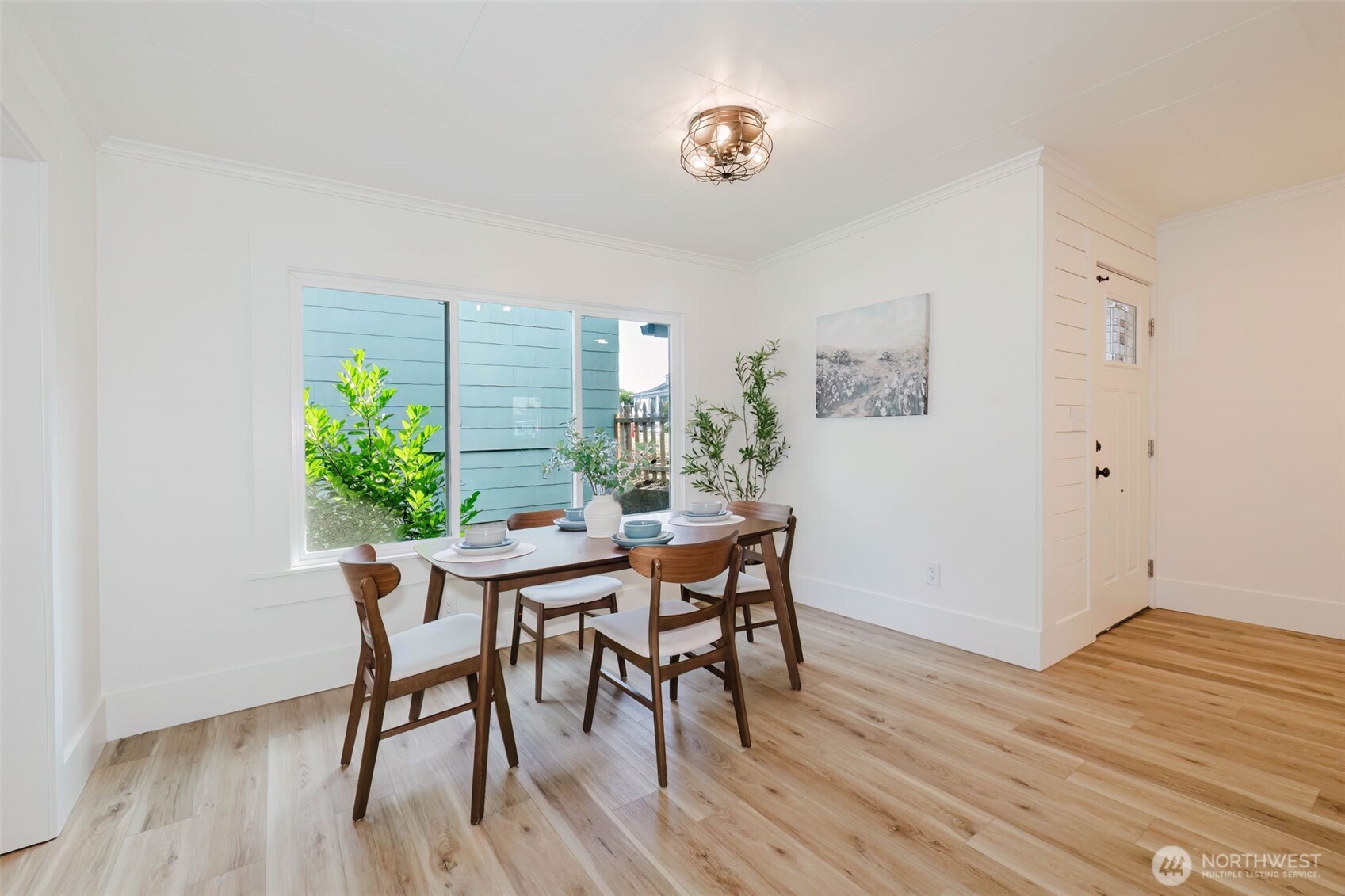 1540 7th Street Bremerton, WA 98337 - Photo 8 of 36 a view of a dining room with furniture and wooden floor
